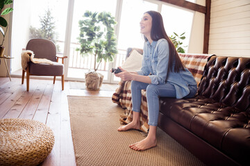 Obraz premium Full body profile side photo of young woman happy positive smile play video game joystick weekend indoors