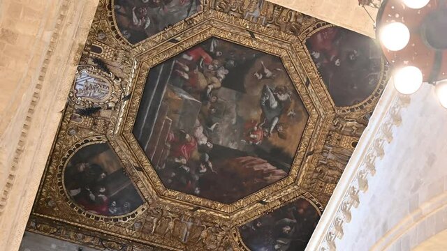 Bari, Puglia, Italy. August 2021. Footage with rotation inside the basilica of San Nicola, in Bari Vecchia, detail of the magnificent frescoes on the ceiling of the church.