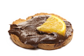 Sesame butter with cocoa on bread and slice orange, tahini paste isolated on white background