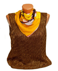 Women's silk scarf. Female silk scarf on a mannequin. a yellow scarf is tied to the dress. On an...