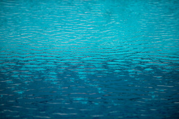 Water in swimming pool, background with high resolution. Wave abstract or rippled water texture.