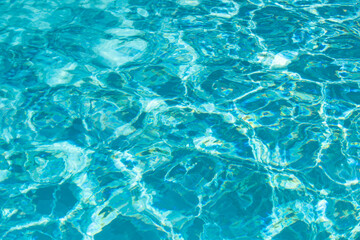 Tansparent clear calm water surface texture. Abstract nature background. Sea water pattern.