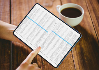 Obraz premium Hands of caucasian female programmer with coffee using tablet with coding on screen