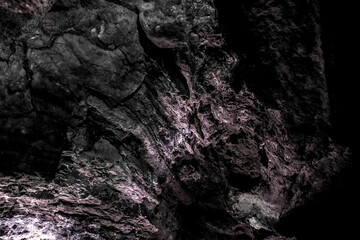 Dark, colorfulTextures of the walls in a lava tube of Canaria island
