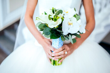 Bride holding bouguet of flowers
