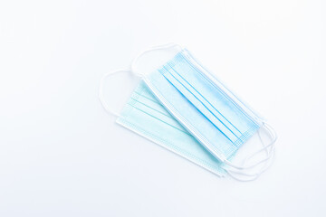 Top view medical mask isolated on white background with copy space. Concept wearing medical mask for protection virus, and distance.