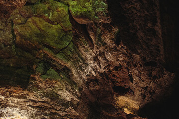 Dark, colorfulTextures of the walls in a lava tube of Canaria island