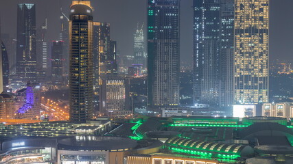 Aerial view of Dubai International Financial Centre DIFC district night timelapse