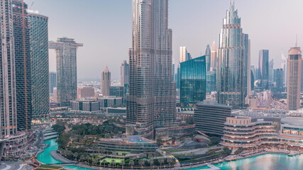 Naklejka na ściany i meble Aerial view of Dubai city day to night timelapse in downtown.
