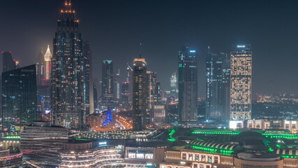 Aerial view of Dubai International Financial Centre DIFC district all night timelapse