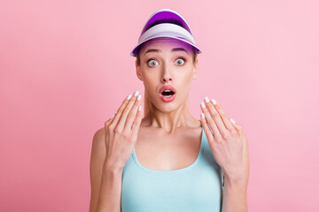 Portrait of attractive amazed worried girlish girl showing fingers nails manicure isolated over pink pastel color background