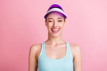 Obraz na płótnie Canvas Photo of adorable flirty young lady wear turquoise tank-top winking smiling isolated pink color background