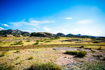 Road in mountains and prarie in Kazakhstan