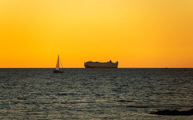 A transport ship at sunset