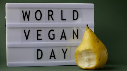 World vegan day. 4k video. Biting fresh pear 