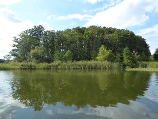 Fototapeta na wymiar Reflection at Mirow Lake, Mecklenburg Western-Pommeranea Germany