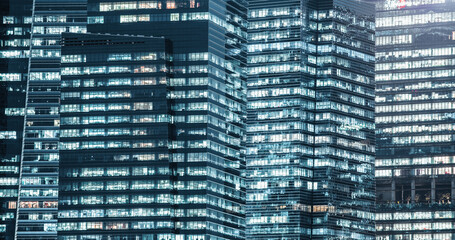 Fototapeta na wymiar skyscrapers windows at night in Singapore