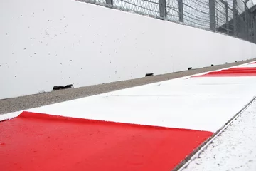 Fotobehang Formule 1 Elements of racing track: red and white kerb, white wall.  © Artem