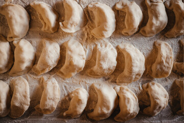 prepare home-cooked dumplings on the table, floured