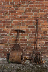 old brick wall and old garden tools
