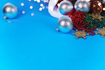 Postcard for congratulations Merry Christmas. Christmas decorations on a blue background. The color...