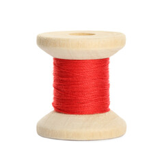 Wooden spool of red sewing thread isolated on white