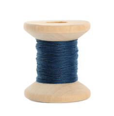 Wooden spool of dark blue sewing thread isolated on white