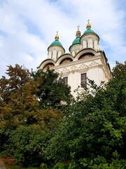 Fototapeta na wymiar Old stone Christian Orthodox church among the trees