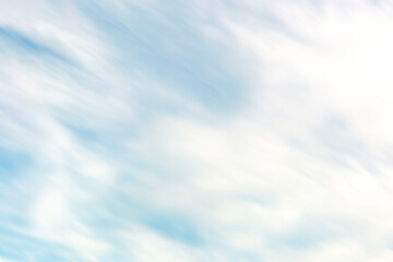 Close up photo of cloudy sky with motion blur effect.