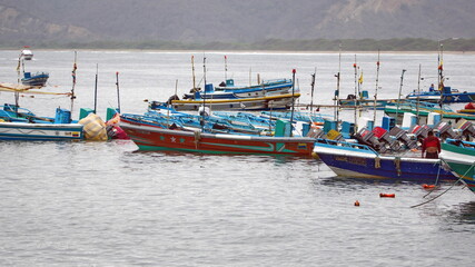 Fototapeta na wymiar Fishing boats moored in the harbor in Puerto Lopez, Ecuador