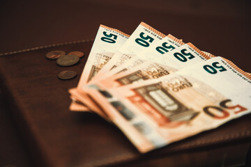 European money lies on a leather book