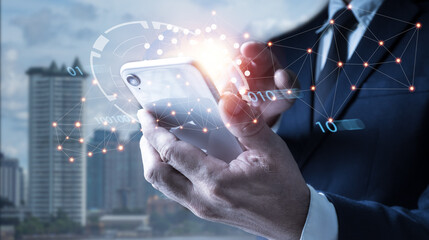 Technology, innovation, and communication concept of a man utilizing a mobile smart phone with a global network connection.