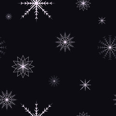 Fototapeta na wymiar winter christmas pattern falling white beautiful snowflakes on dark background happy new year
