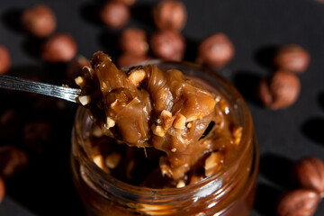 Hand made vegan caramel with nuts. Soft focus. Close-up. Copy space.Top view. Organic food.