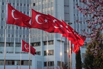 National flags of Turkey and spring blossoms in front of the Ministry of Foreign Affairs building in Ankara