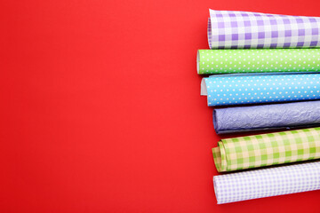 Rolls of craft papers on red background