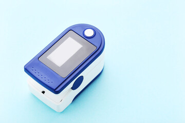 Pulse oximeter on blue background