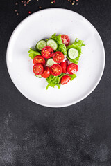 vegetables salad mix petals lettuce leaves, tomato, cucumber, onion vitamin aperitif fresh meal snack on the table copy space food background keto or paleo diet veggie vegan or vegetarian  no meat