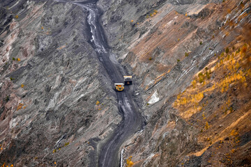 two cars on the road in a quarry