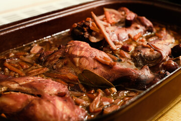 Oven baked rabbit in red wine gravy