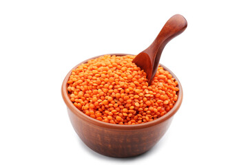 Red lentils with spoon and bowl isolated on white background