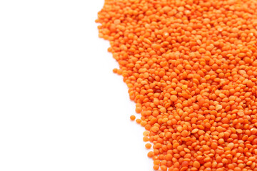 Red lentils on white background