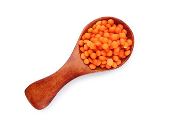 Red lentils with spoon isolated on white background