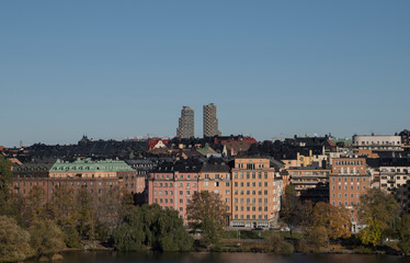 Fototapeta premium Apartment houses and tower buildings at the island Kungsholmen an colorful autumn day in Stockholm,