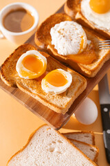 fried Toast bread with four different types of cooked chicken eggs, scrambled eggs, fried eggs, poached egg and creamed egg. Breakfast of chicken eggs. methods of making eggs for breakfast