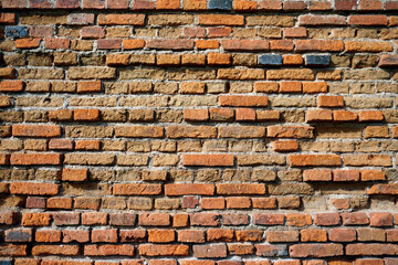 Texture. Background. The wall of an old building in the open air. Weathered bricks. Masonry.
