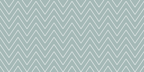 Christmas chevron pattern. Abstract background with white zig-zag stripes on a grey background. Vector illustration