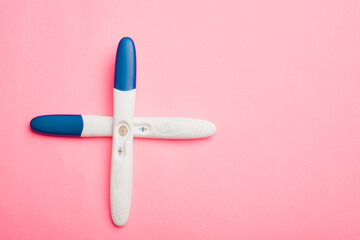 Pregnancy test on a pink background . Positive test. Pregnancy copy space.
