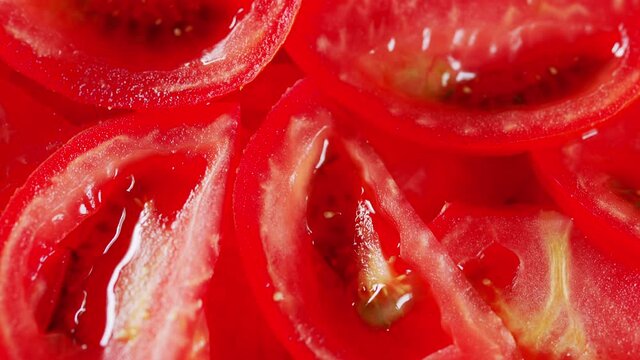 Beautiful red slice tomato. Pan up.