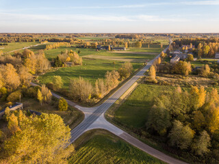 countryside roads in autumn colors with sunset light